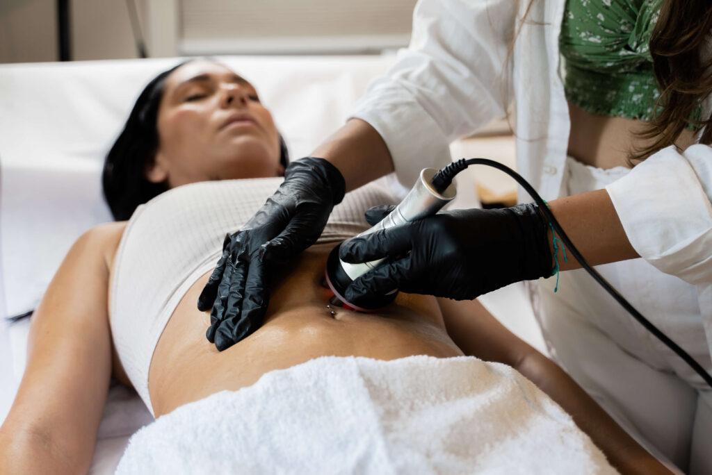 A woman is being treated by a doctor in a hospital.